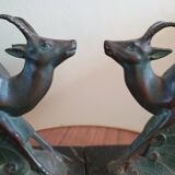 Pair - Chamois metal bookends with green patina & black marble base
