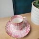 Fine porcelain coffee cup and saucer