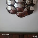 This vintage Reggiani piece is made from a metallic structure