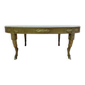 Oval coffee table with deer legs and marble in Empire style.