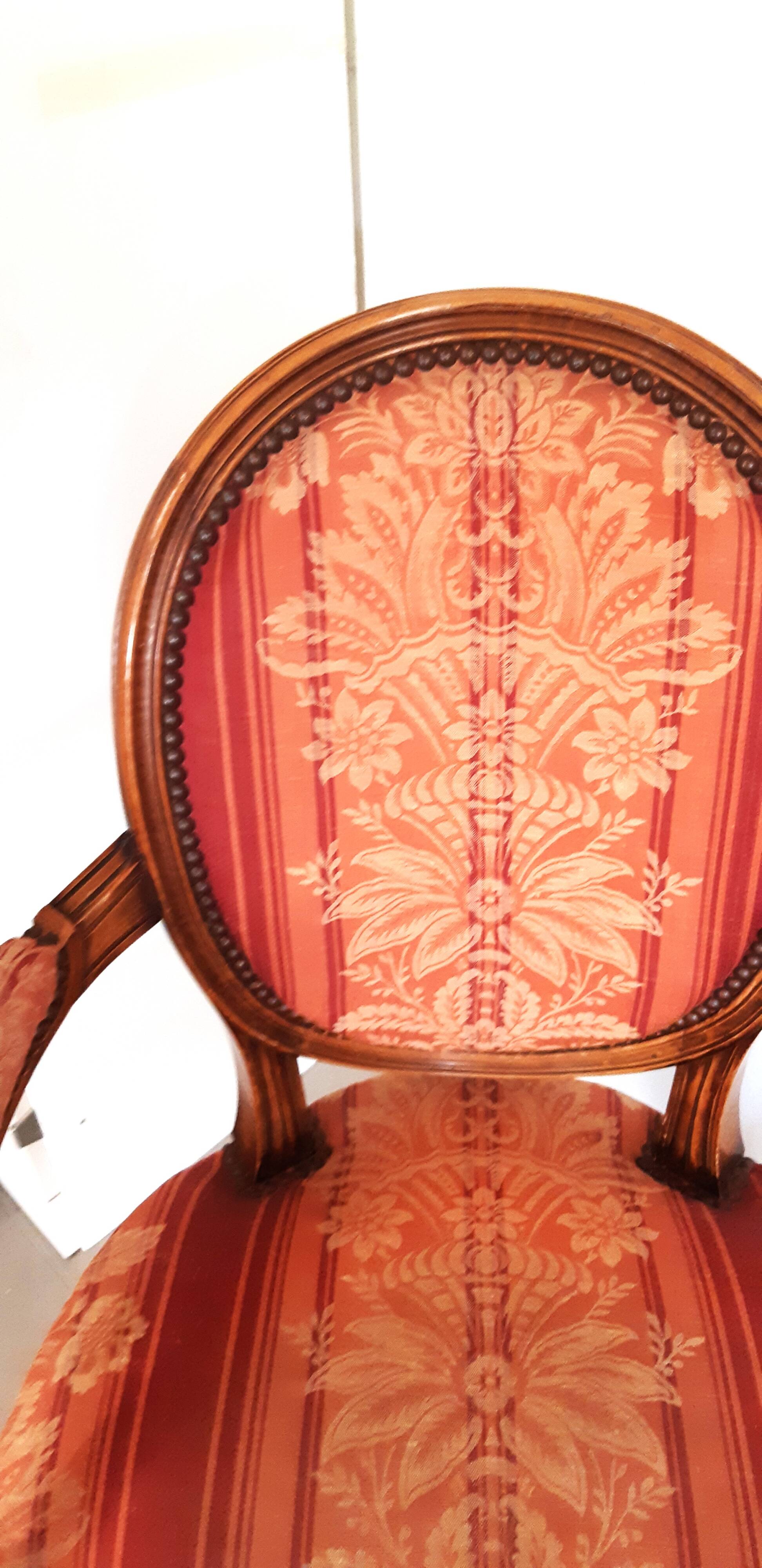 Pair of Louis XVI style cabriolet armchairs with medallion
