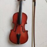 violin and decorative archer in antique varnished wood