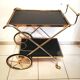 Golden brass trolley wheeled dessert and glass trays