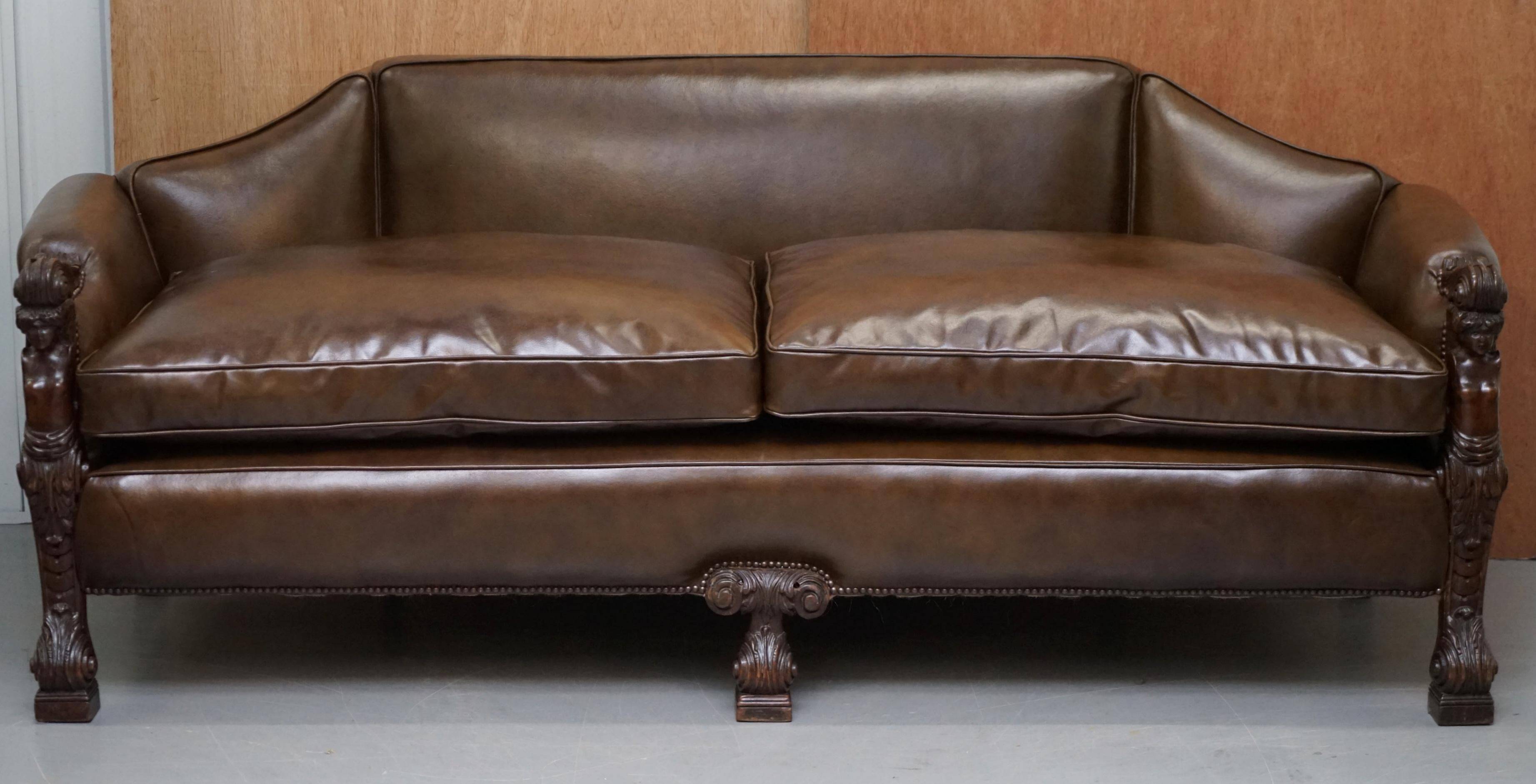 Restored Regency canapé in leather with sculpted Hermès frame.