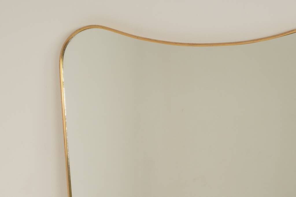 Patinated brass-framed mirror. 1980s/90s.