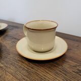 5 enameled stoneware cups and saucers