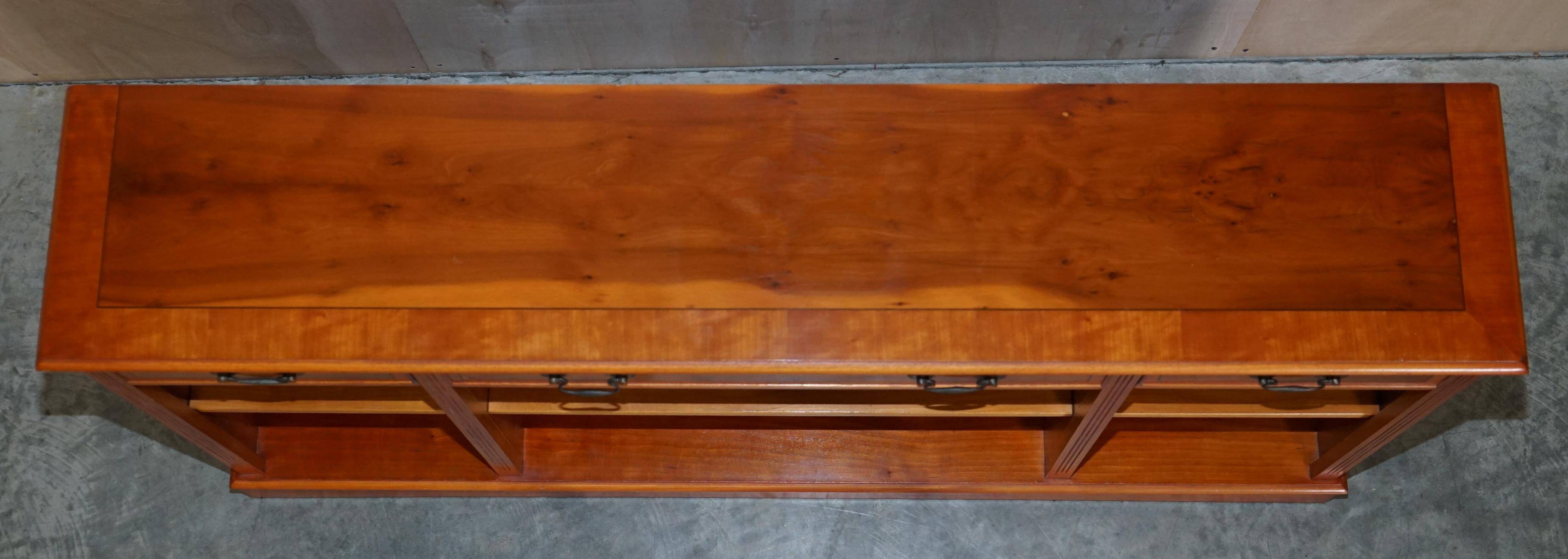 Vintage yew wood library/buffet with three drawers.