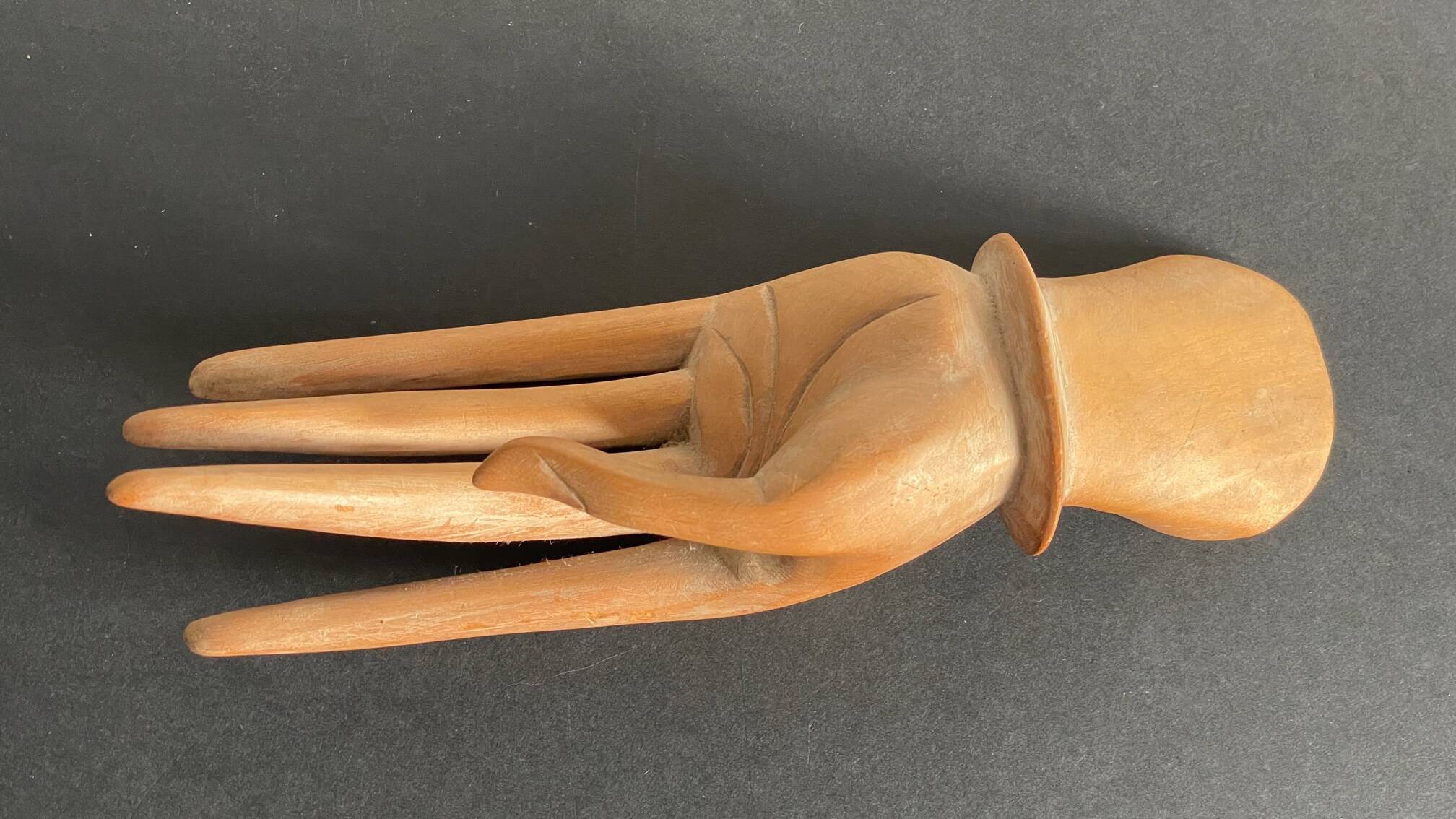Wooden hand sculpture