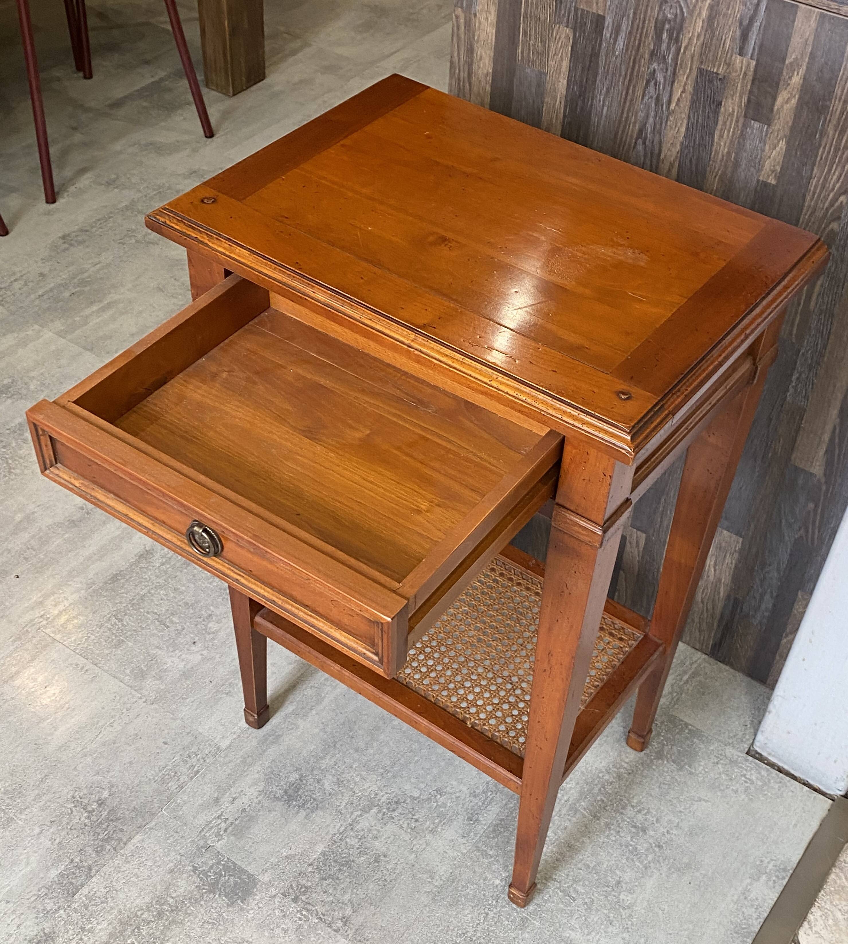 Occasional table in cherry wood, 1 drawer, 1 cane shelf, 1950.