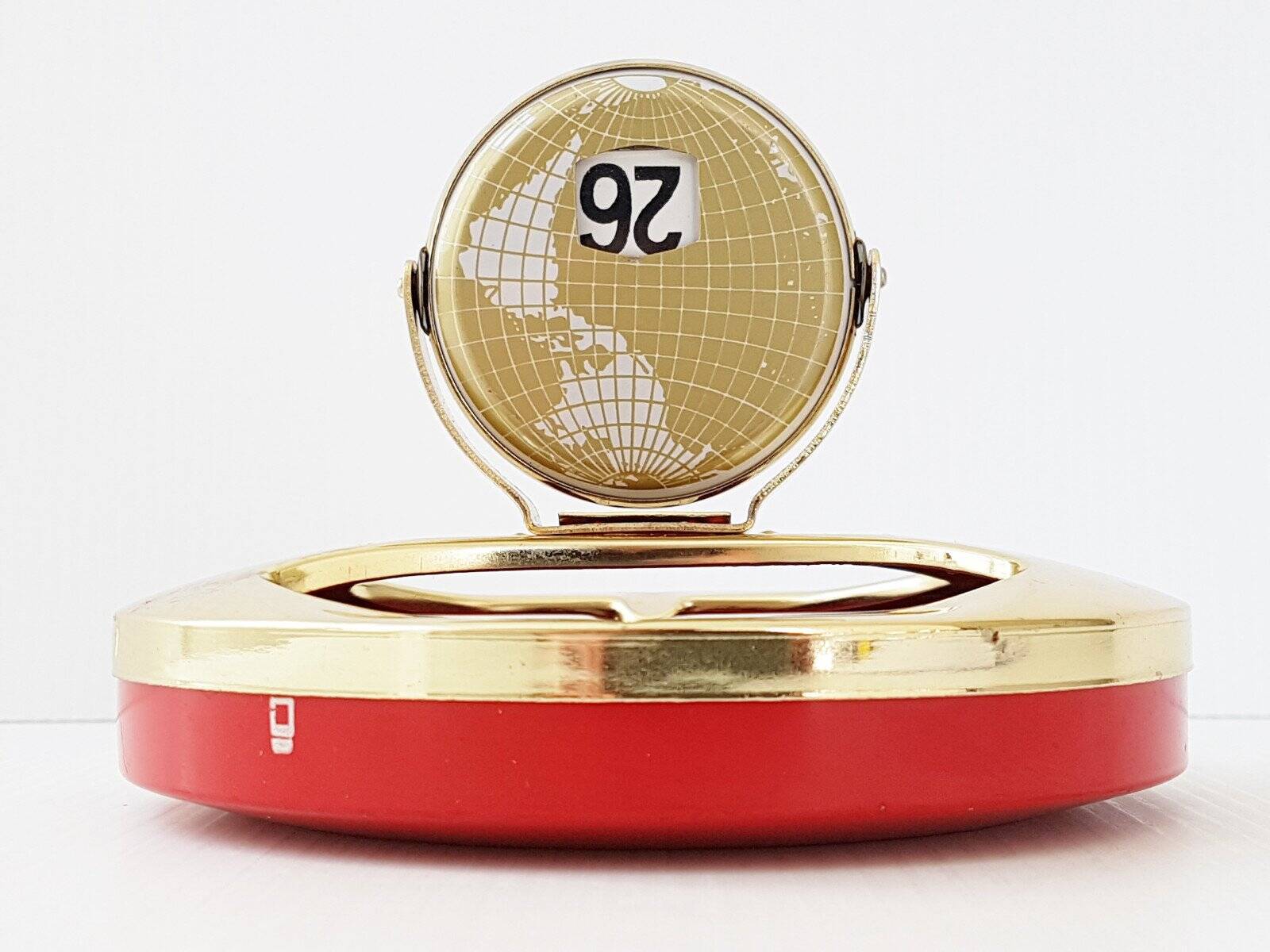 Vintage 1950s brass gold-plated globe perpetual calendar ashtray.
