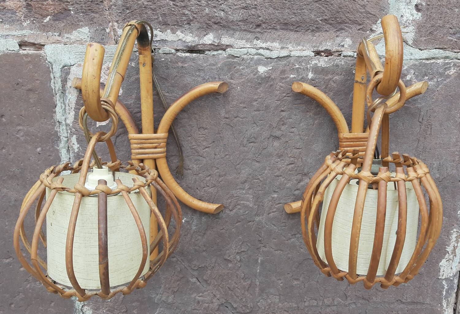 Pair of Louis Sognot rattan wall lights.
