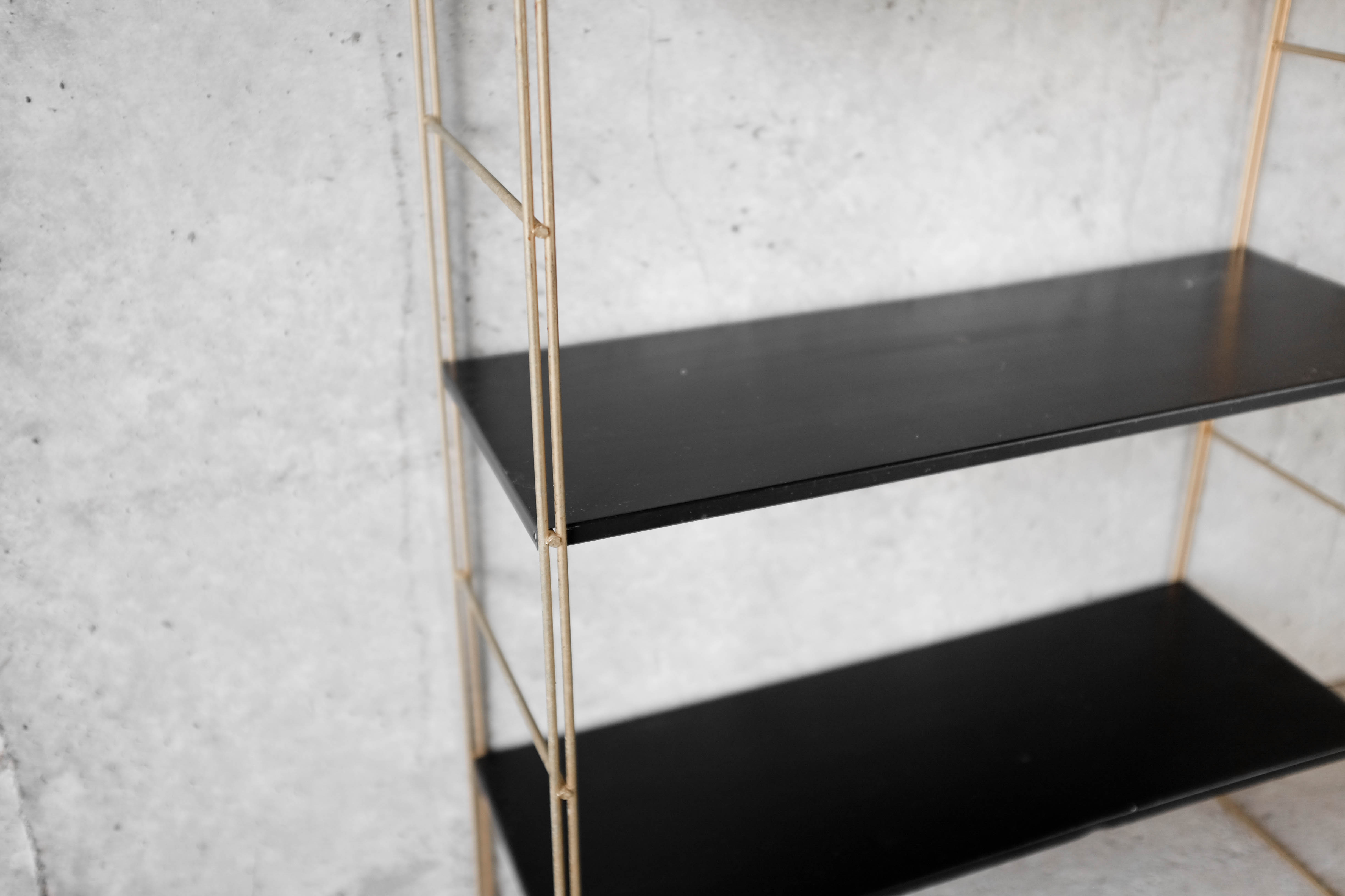 Brass string shelf