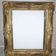 Miroir en bois et stuc redoré de style rocaille 33x29