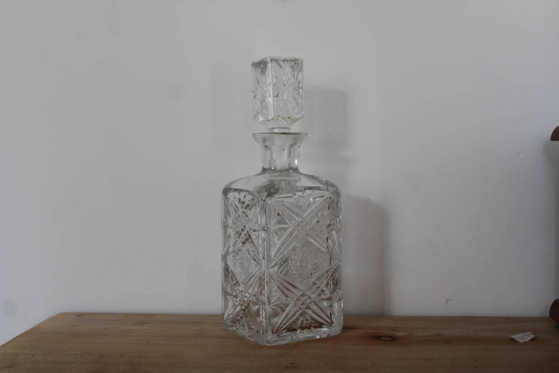 Antique cut glass carafe, probably crystal – Geometric patterns and matching stopper.