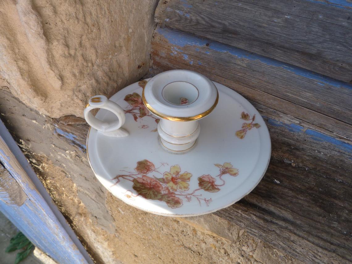 Ancient 1900 porcelain hand-held candlestick