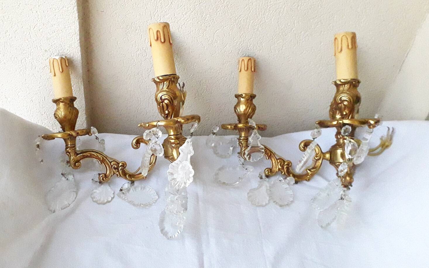 pair of bronze wall lights with pendants