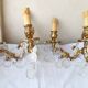 pair of bronze wall lights with pendants