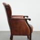 Classic vintage wingback chair in sheepskin and wood