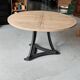 Industrial table with cast iron legs and teak top