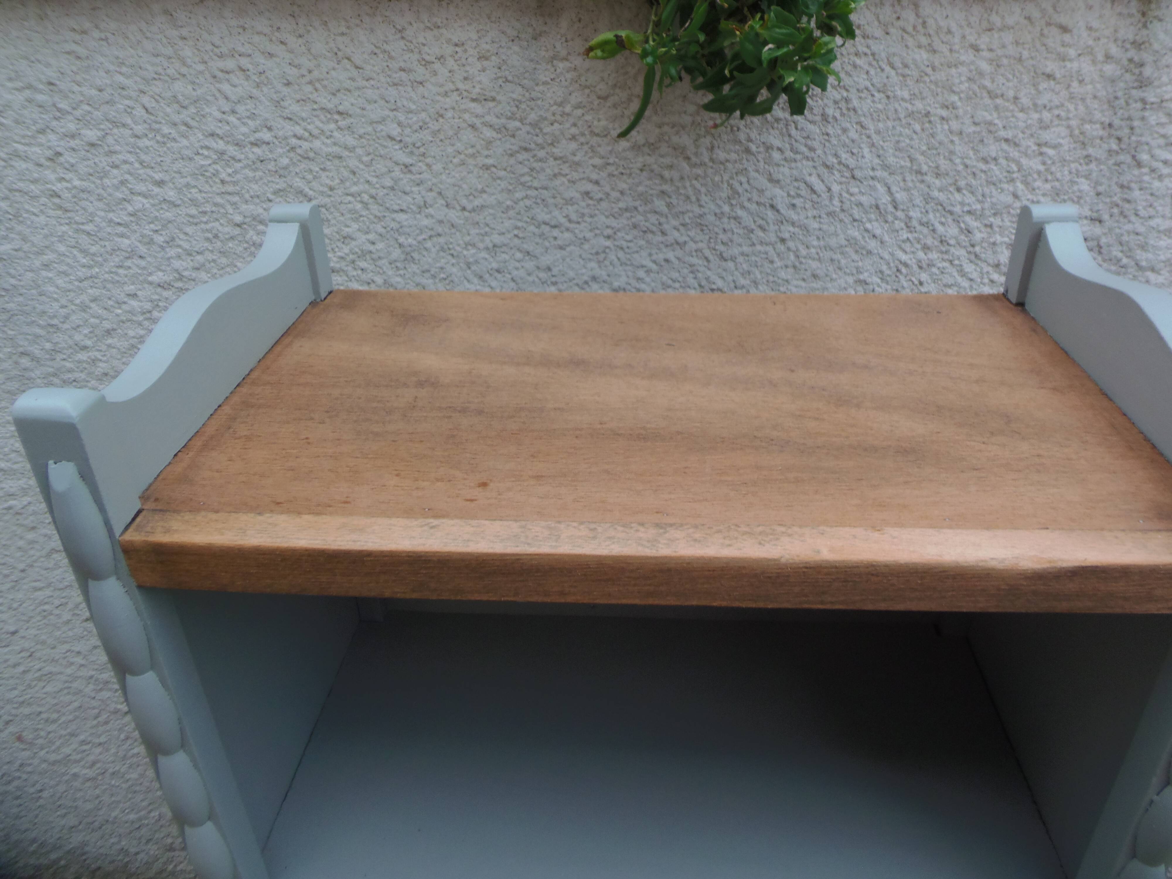 Vintage furniture of shallow depth re-enchanted in grey-green.