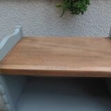 Vintage furniture of shallow depth re-enchanted in grey-green.