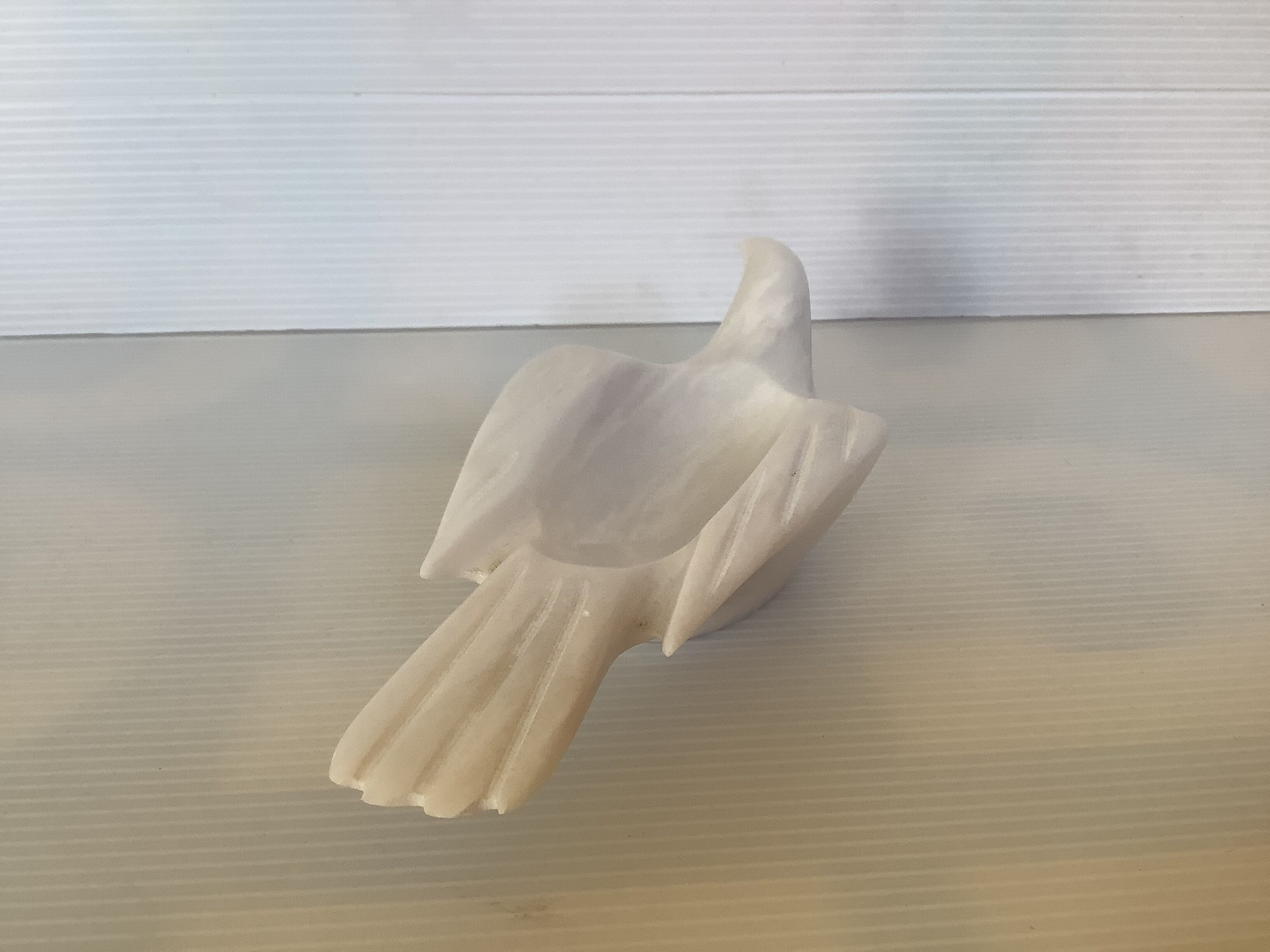 Marble bird empty pocket