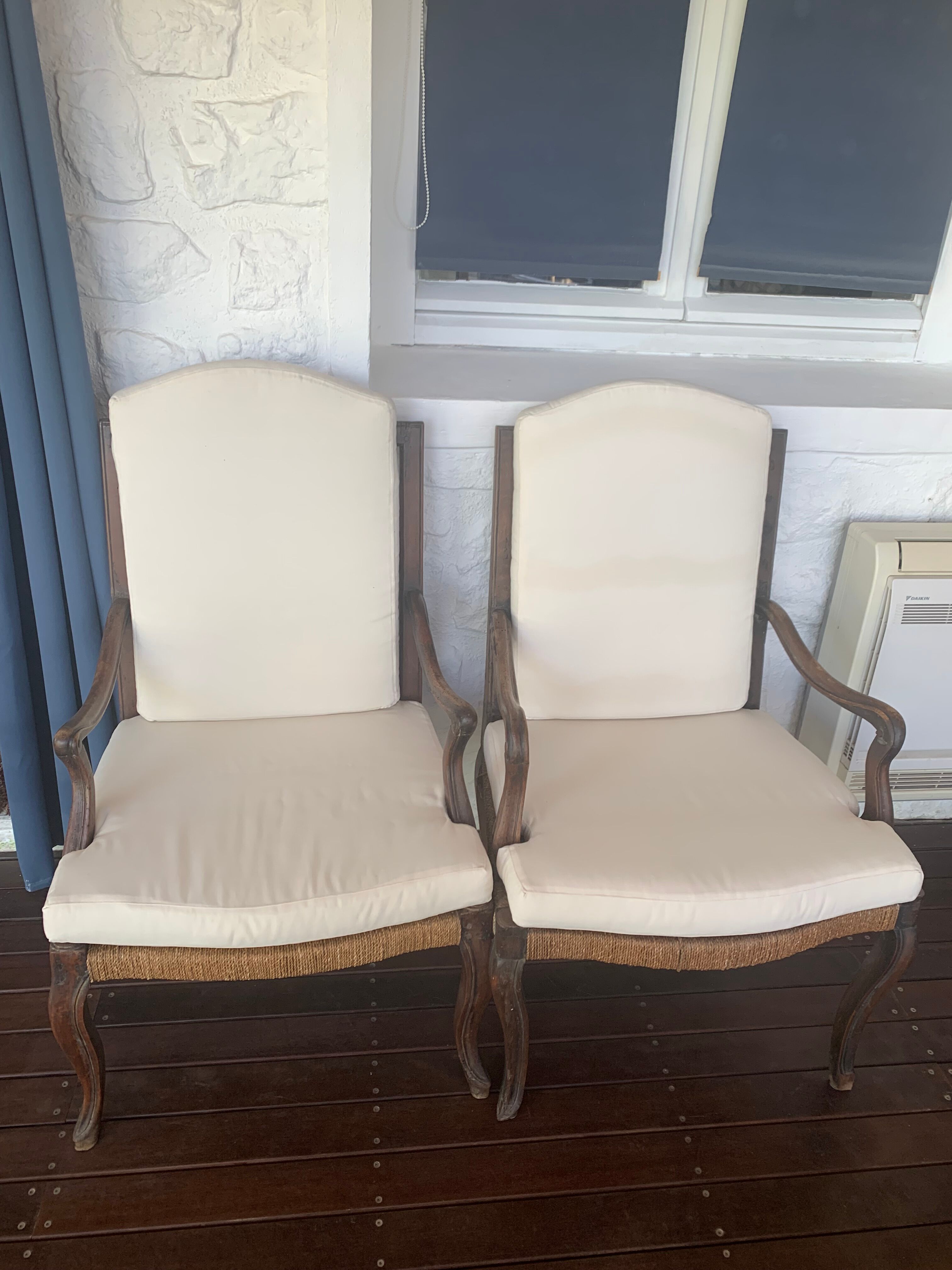 Pair of Louis XV style armchairs in walnut with rush seating.