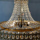 Chandelier cascade of tassels and brass