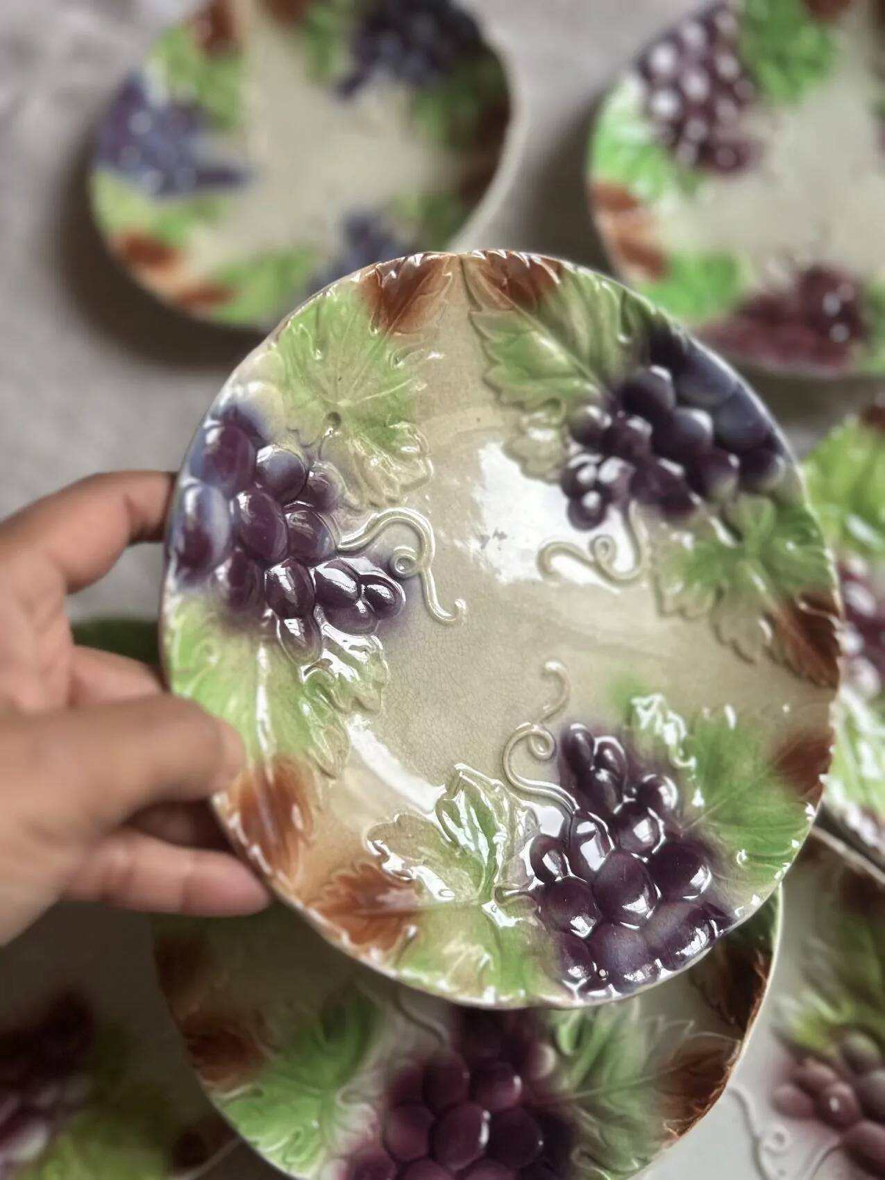 Set of eight flat dessert plates in barbotine earthenware with grape decoration – circa 1900.