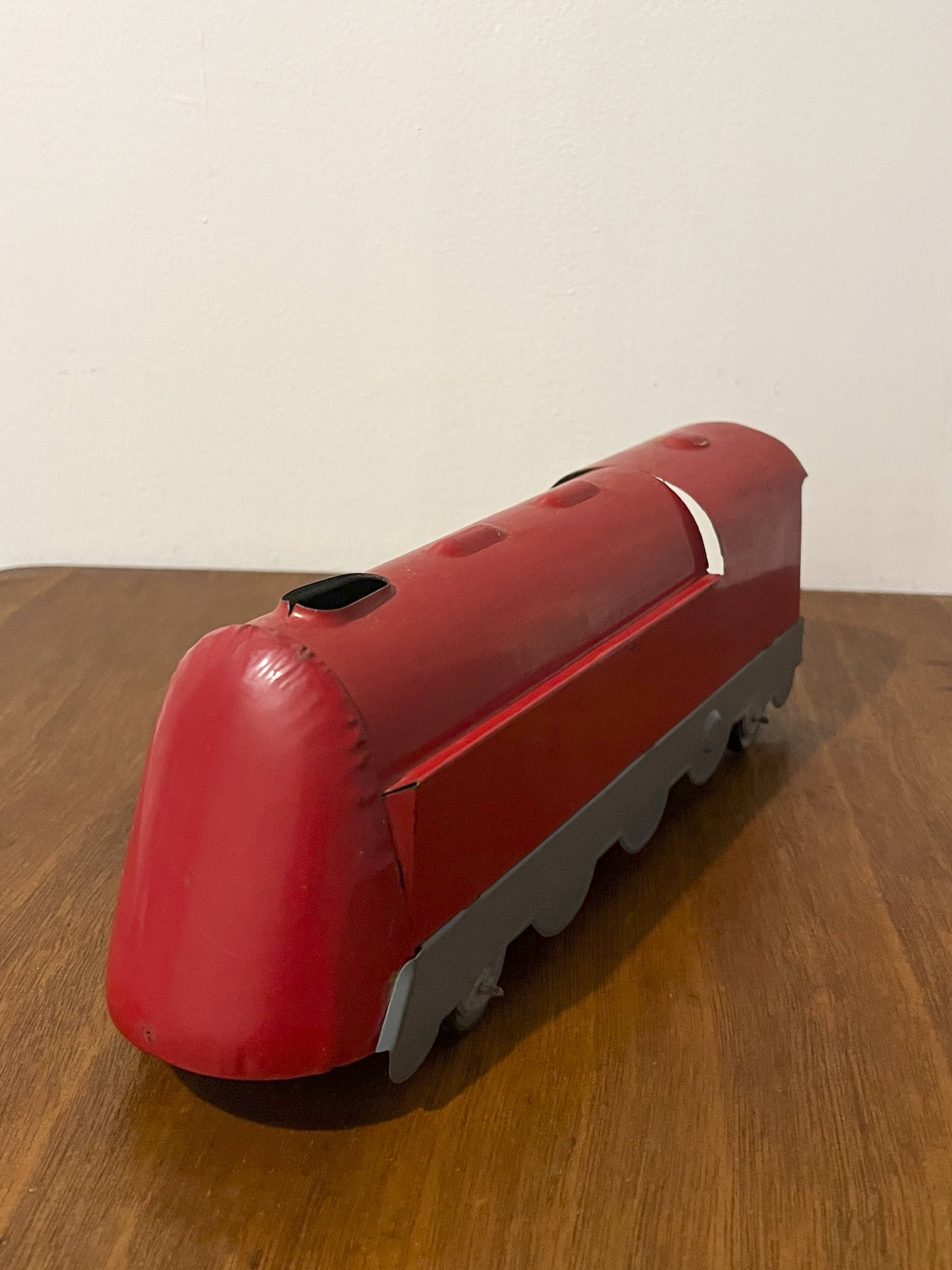 Red sheet metal locomotive 60s