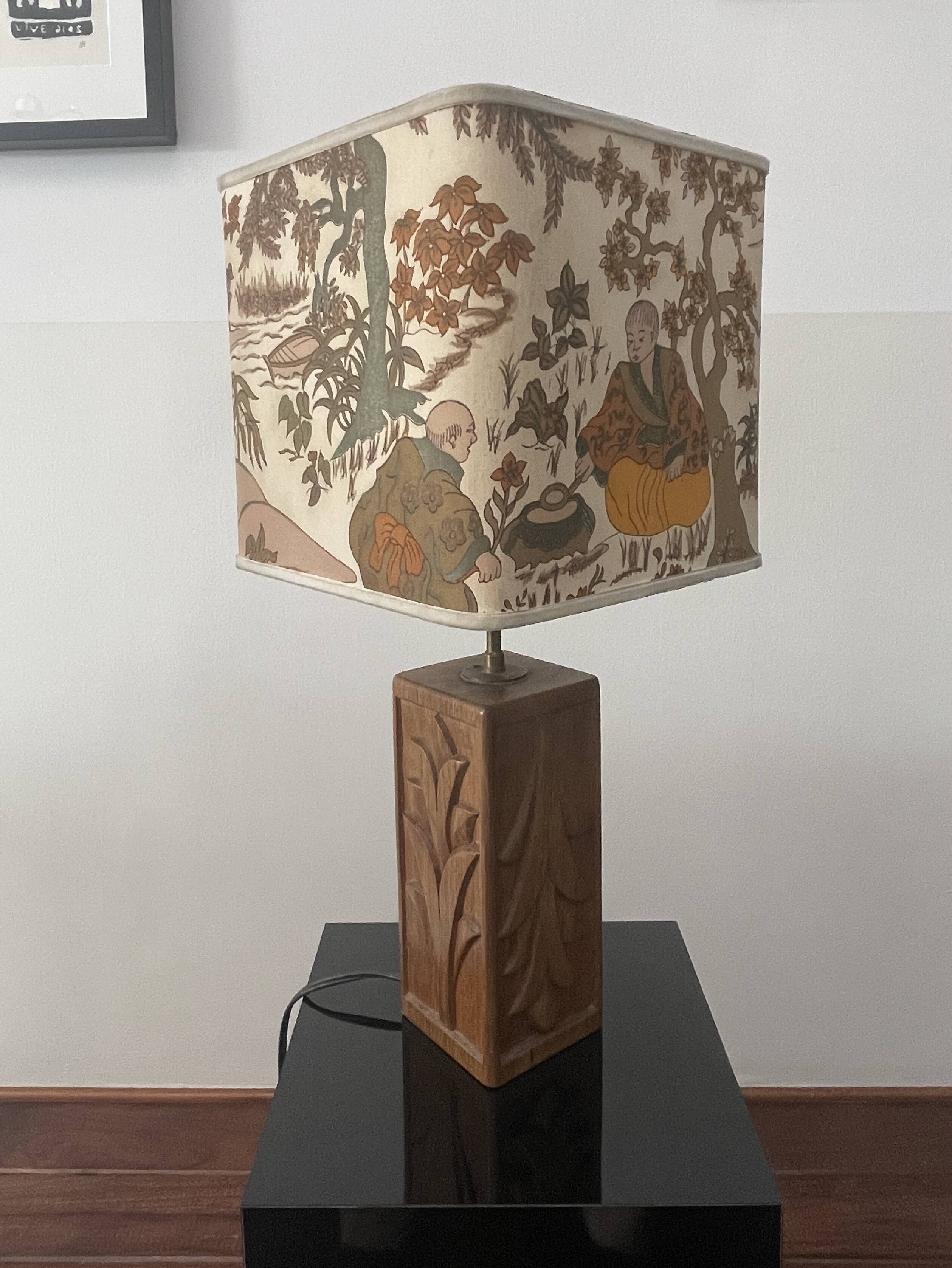 Wooden lamp with carved plant decoration from 1930-50, sold with a 1970 lampshade.
