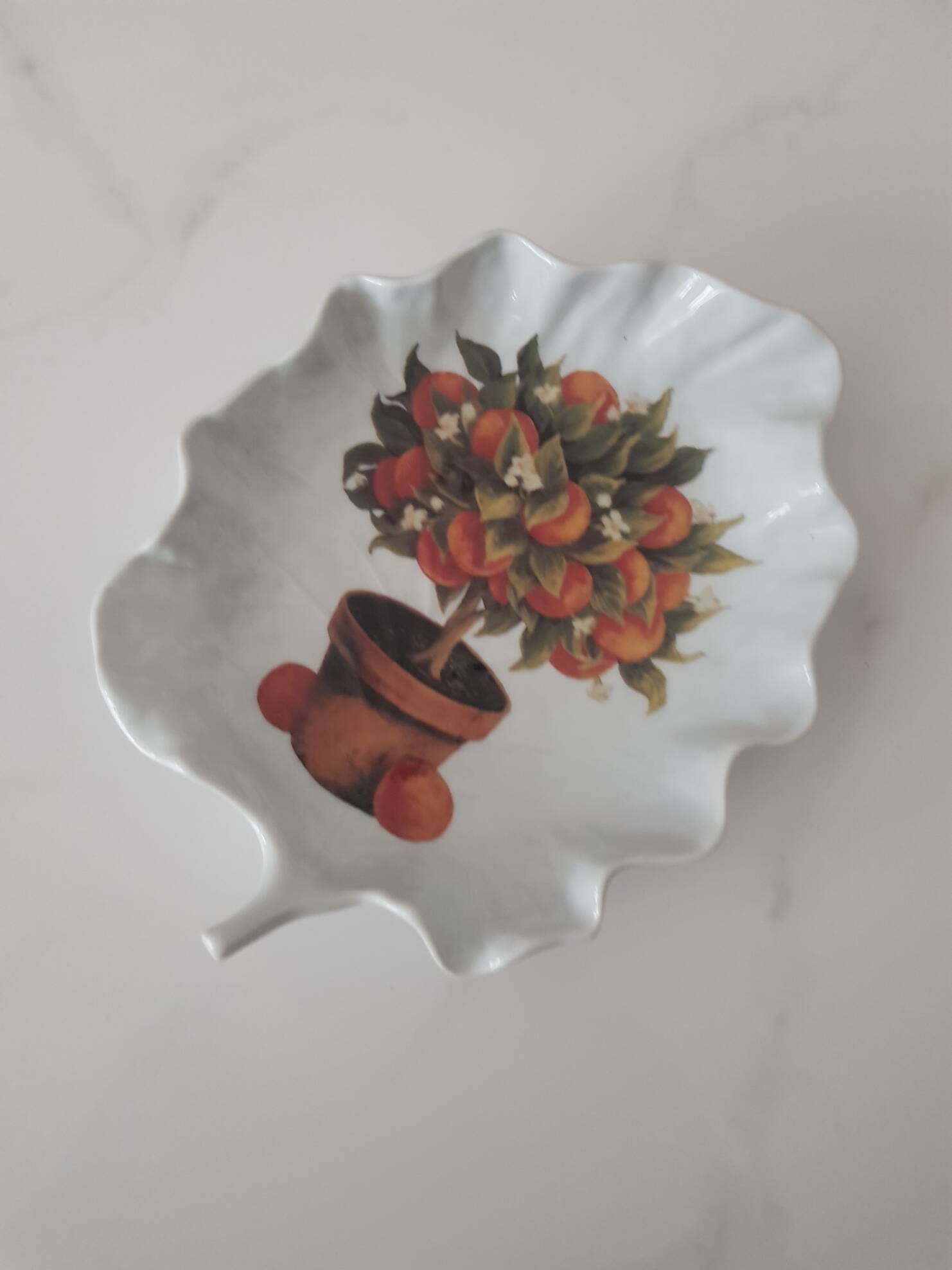 Porcelain vide poche from Limoges with orange decoration.