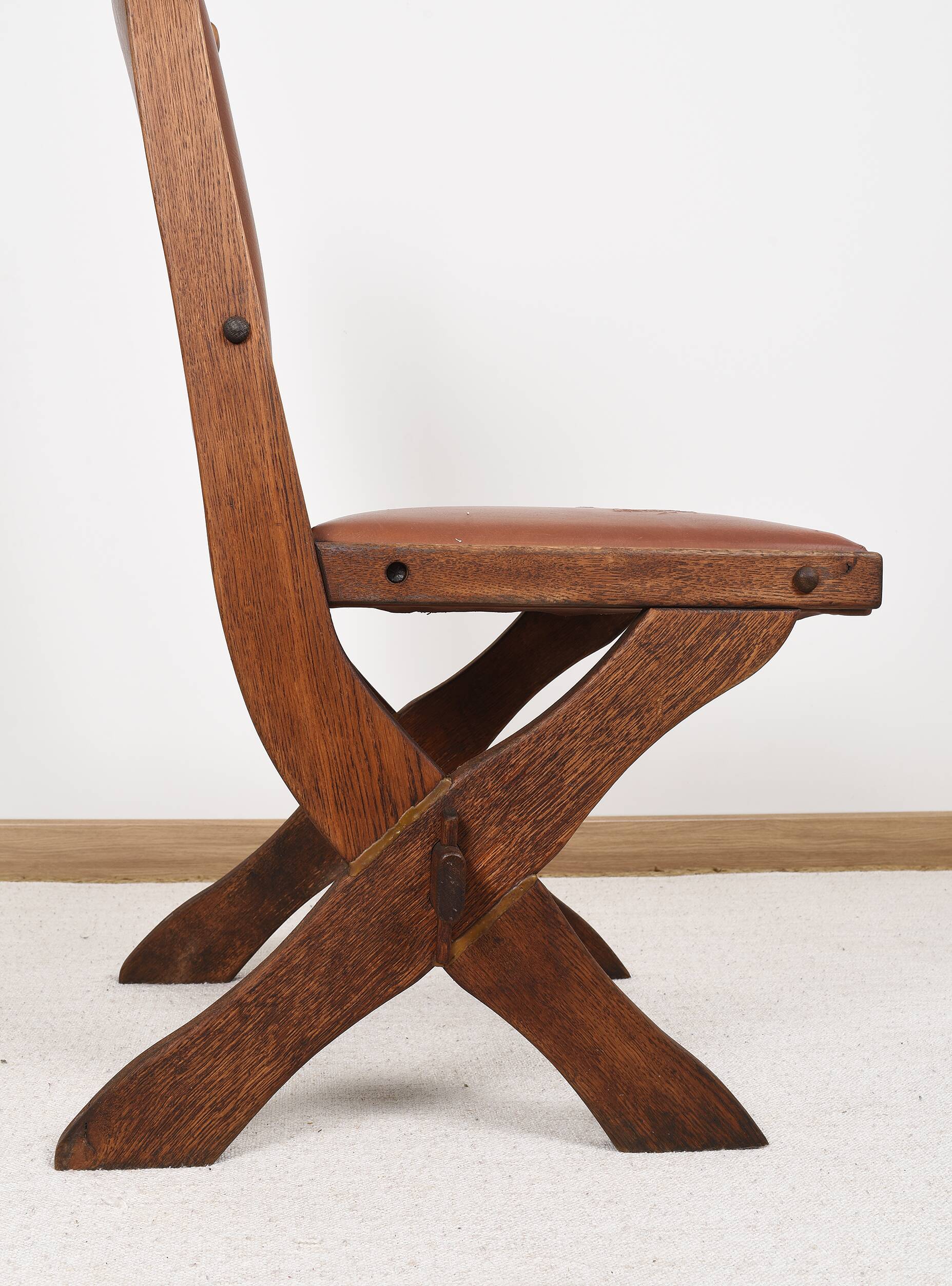 Pair of brutalist style chairs, in wood and leather.