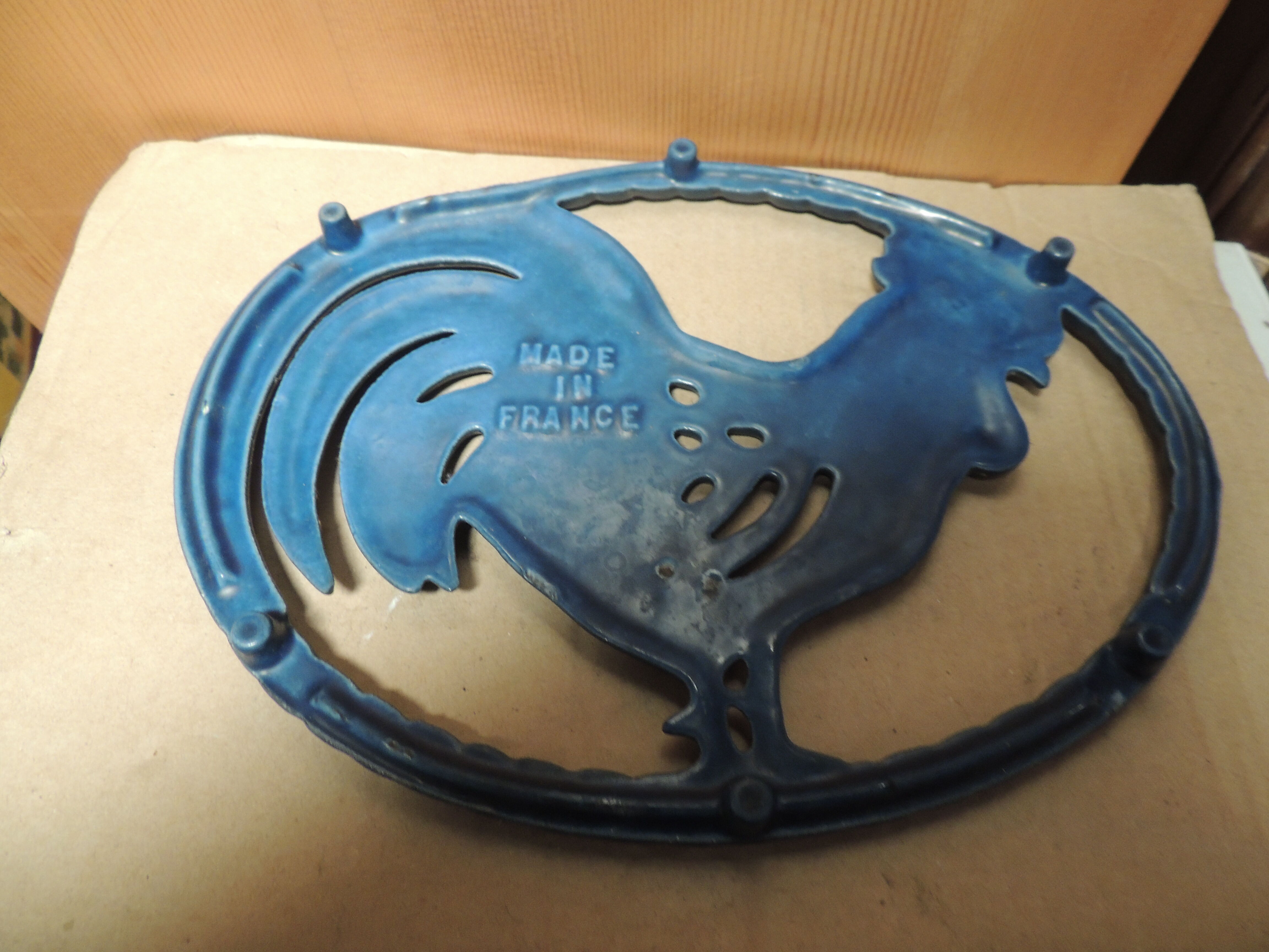 Blue cast-glass flat underside rooster pattern