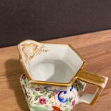 Old Paris porcelain milk jug with polychrome and gold bird floral decoration