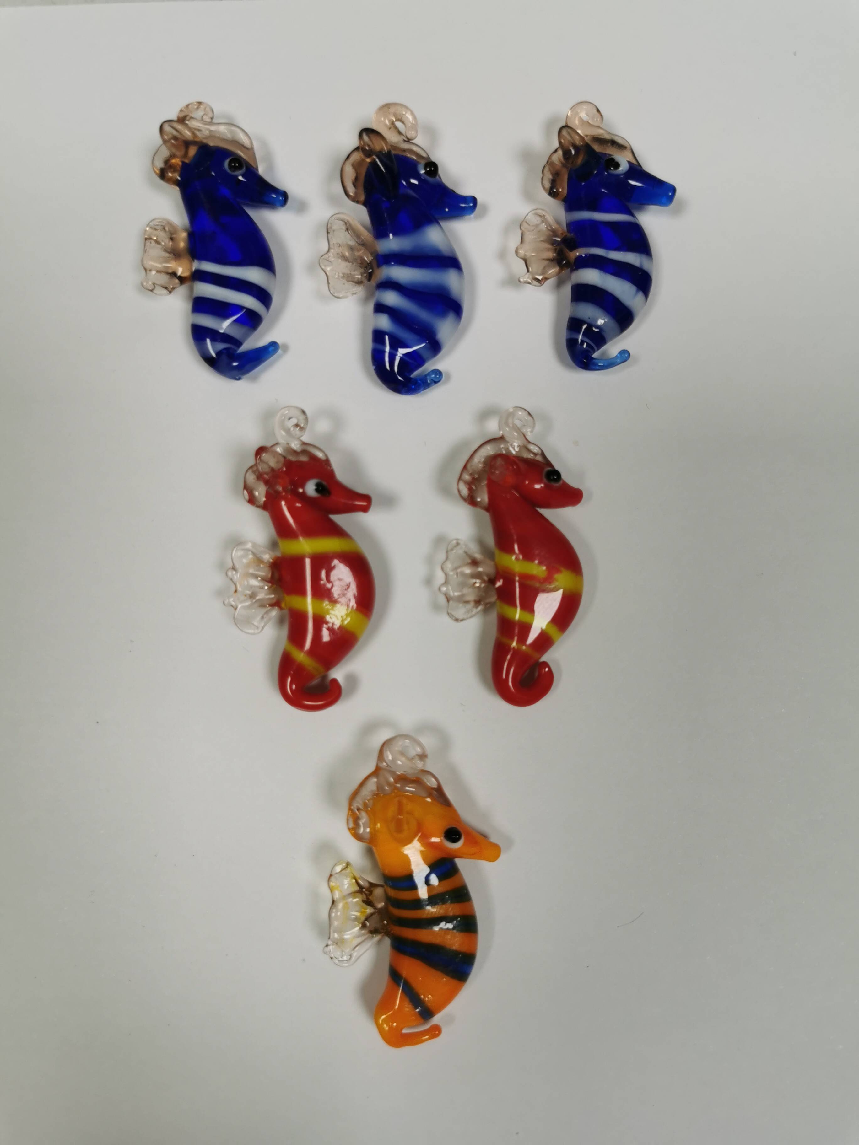 Six small Murano Seahorses in glass.