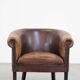 Sheep leather club chair finished with decorative nails