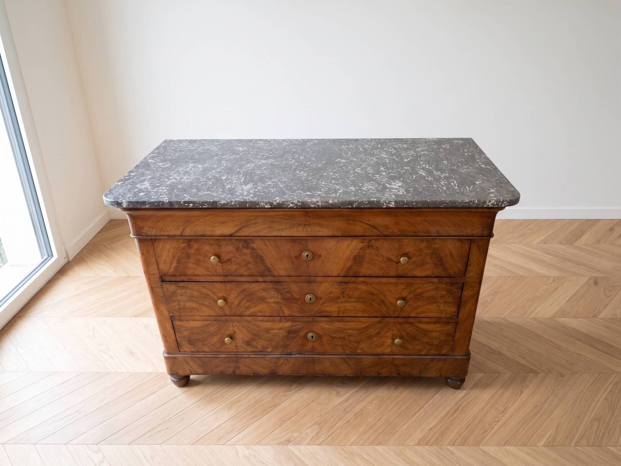 Antique walnut commode with a grey marble top.