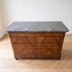 Antique walnut commode with a grey marble top.