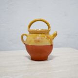 Old gargoulette pot in glazed terracotta