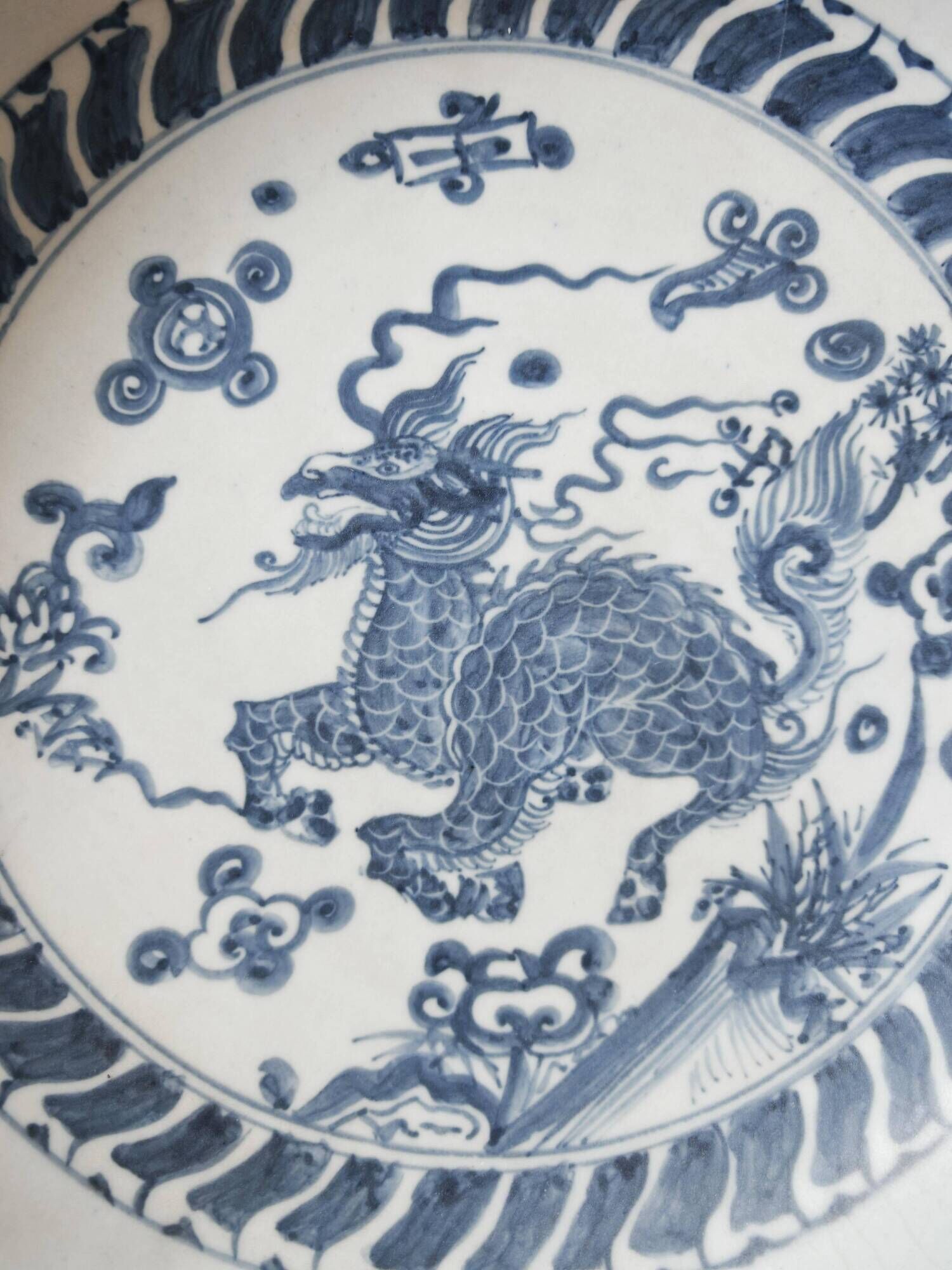 Pair of antique Chinese decorative plates with dragon motif.