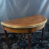 A Louis XVI period mahogany half-moon table forming a console/games table