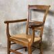 Louis Philippe armchair in walnut and straw, 19th century.