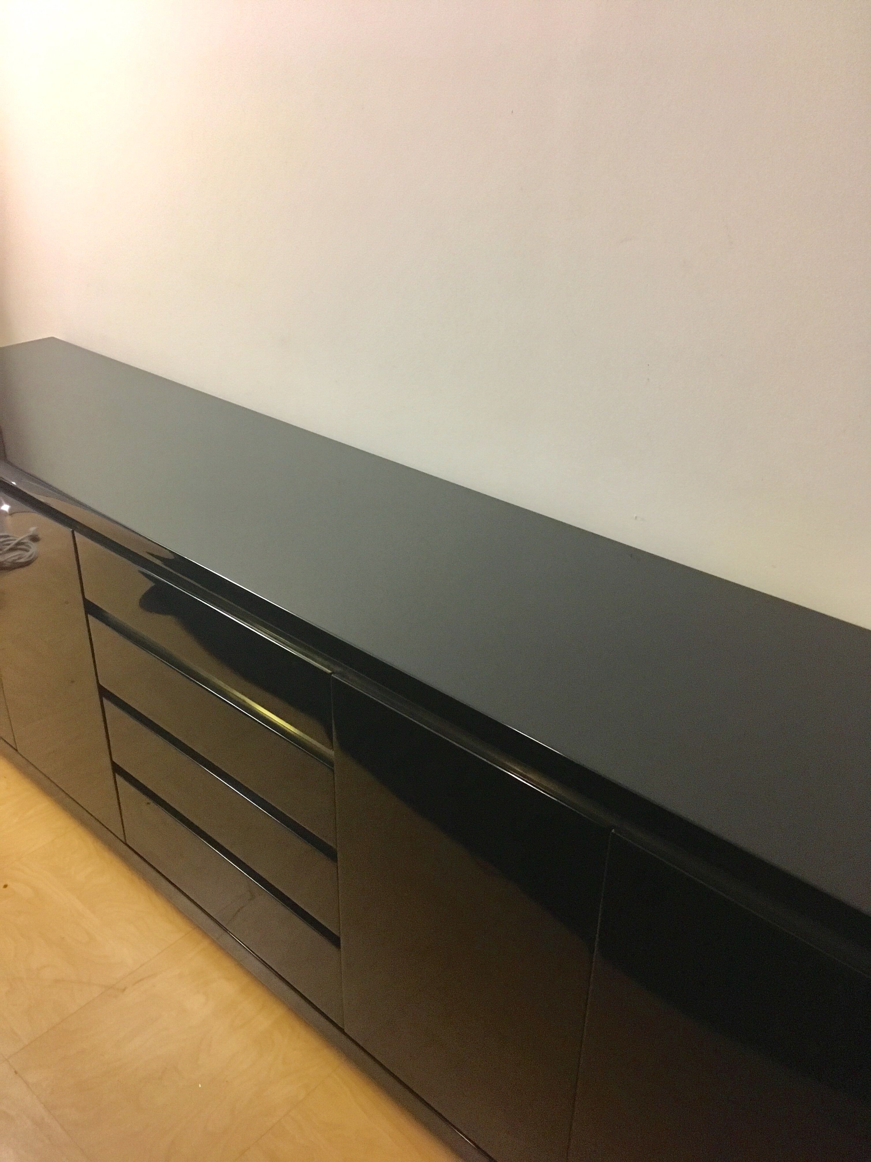 Wide row black lacquer and brass