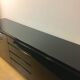 Wide row black lacquer and brass