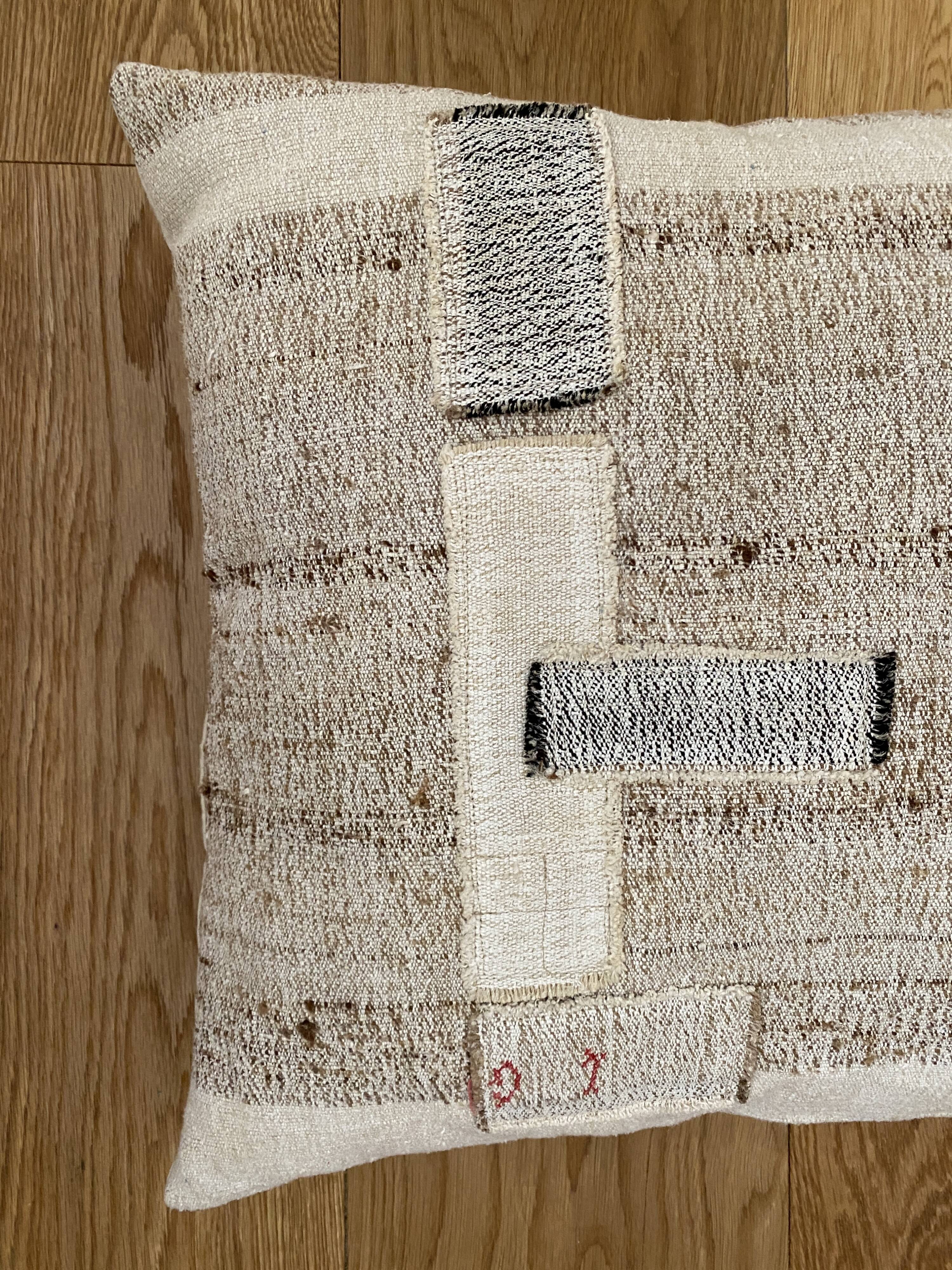 Old canvas cushion woven kilim style, patched