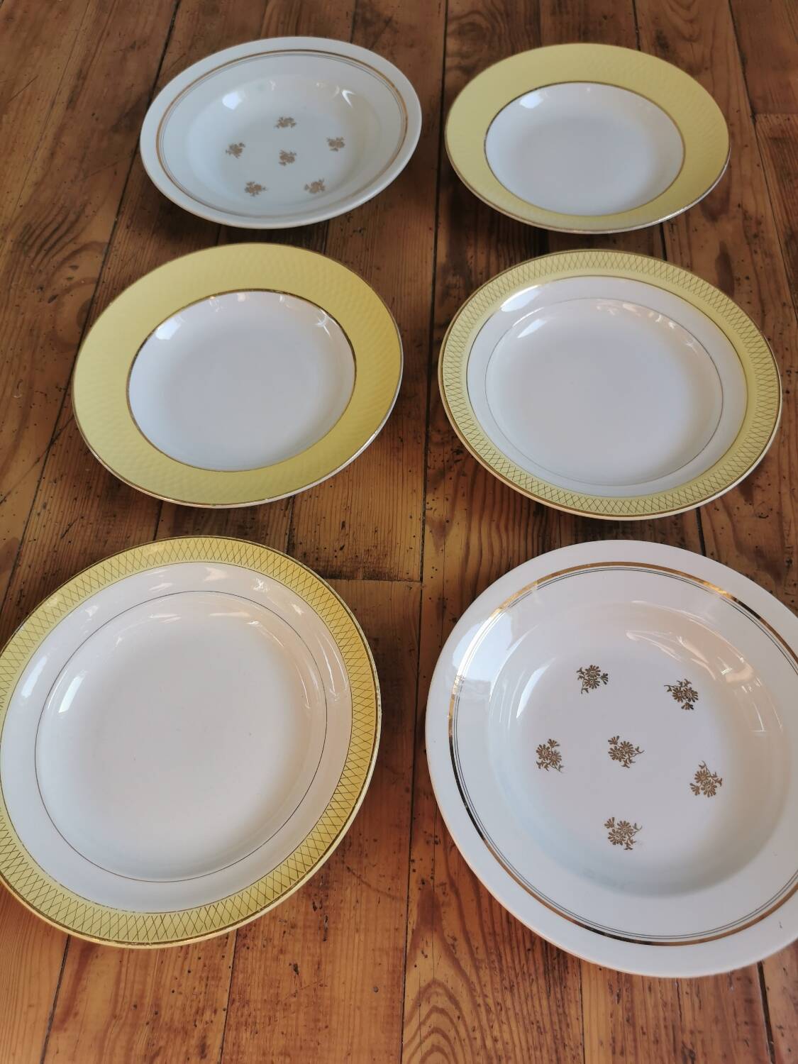 Vintage mismatched yellow and gold soup plates