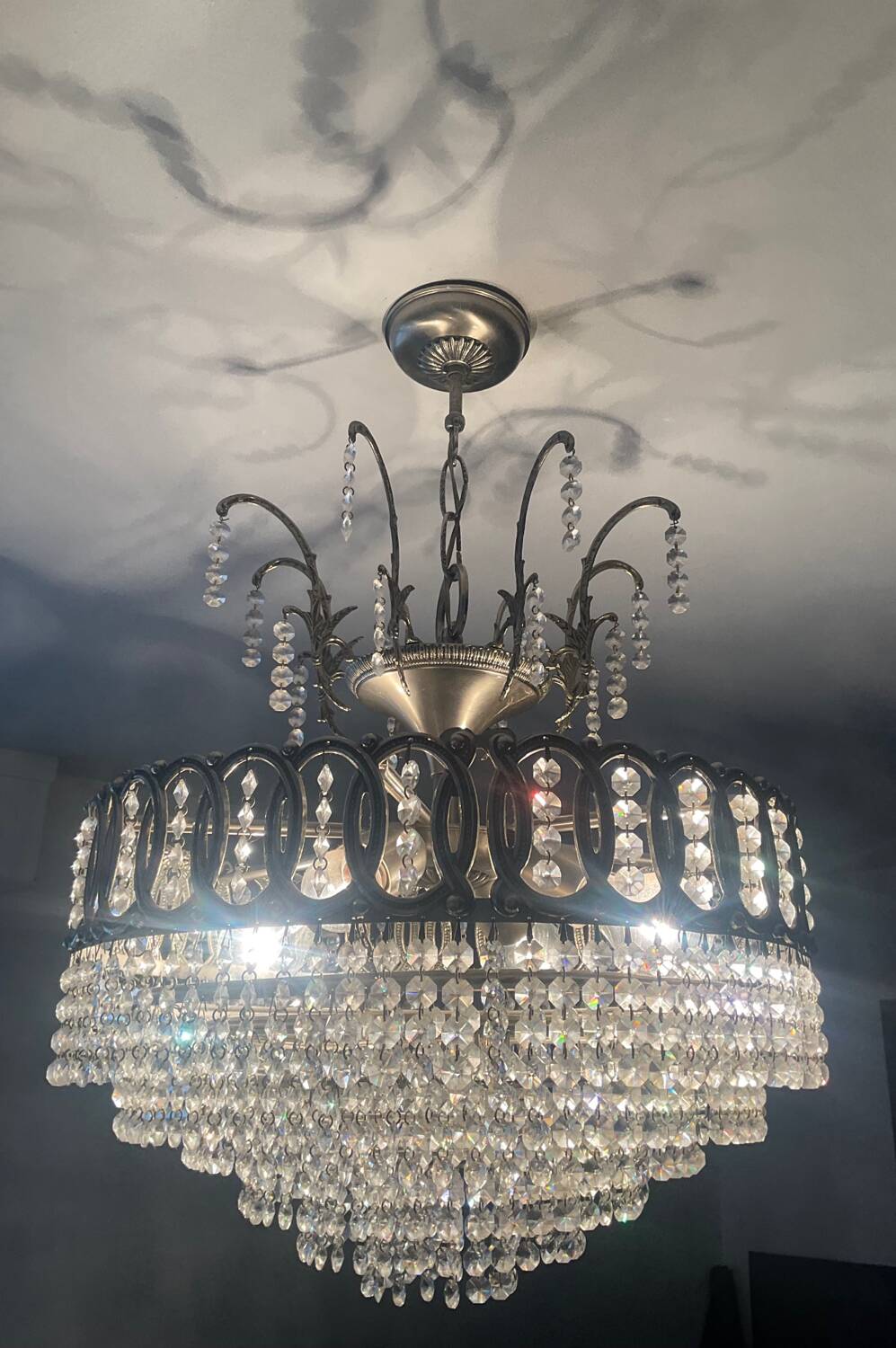 Cascading chandelier with crystal and silvered bronze pendants