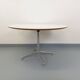 Vintage Eames round table for Vitra in white melamine, wood, and metal.