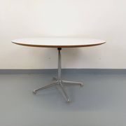 Vintage Eames round table for Vitra in white melamine, wood, and metal.